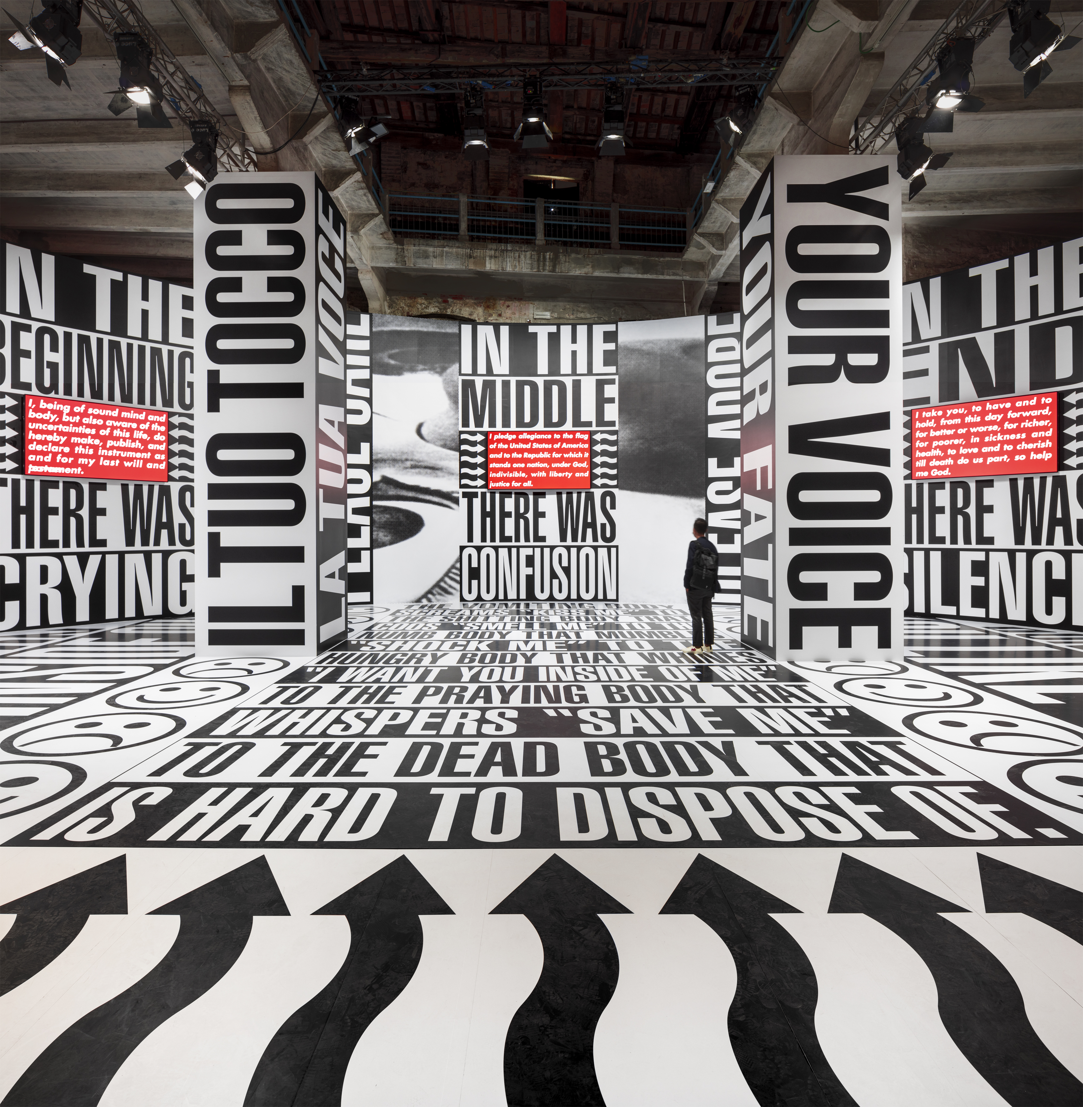 Barbara Kruger, Untitled (Beginning/Middle/End), 2022, Side specific installation, print on vinyl Three-channel video installation (on 3 flatscreen monitors), sound Dimensions variable 5 min. 35 sec. Installation view, The Milk of Dreams - 59th International Art Exhibition, La Biennale di Venezia, Venice, April 23– November 27, 2022 Courtesy the artist and Sprüth Magers Photo: Timo Ohler.