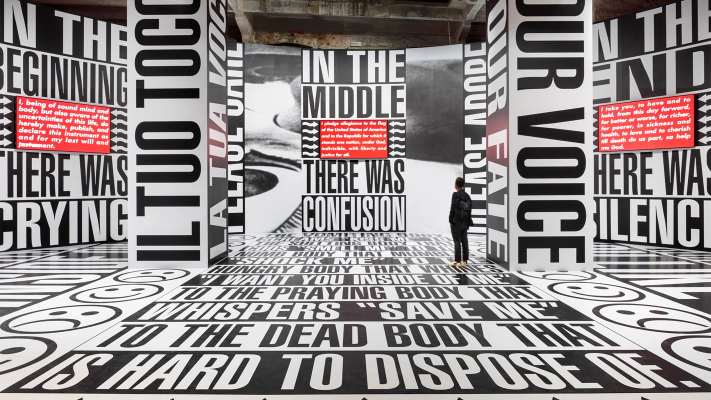 Barbara Kruger, Untitled (Beginning/Middle/End), 2022, Side specific installation, print on vinyl Three-channel video installation (on 3 flatscreen monitors), sound Dimensions variable 5 min. 35 sec. Installation view, The Milk of Dreams - 59th International Art Exhibition, La Biennale di Venezia, Venice, April 23– November 27, 2022 Courtesy the artist and Sprüth Magers Photo: Timo Ohler.